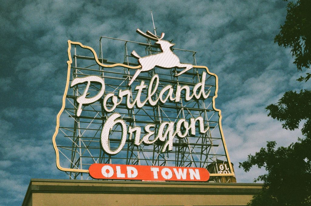 A sign that says Portland, Oregon, Old town