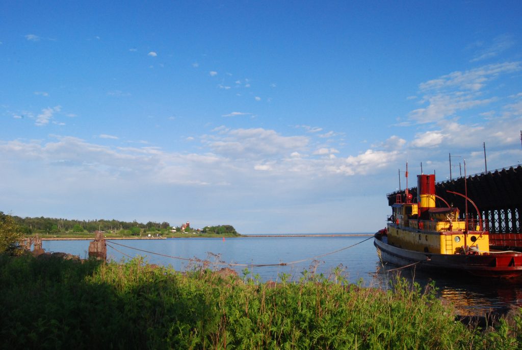 Edna G tugboat, now a museum, lying at anchor.