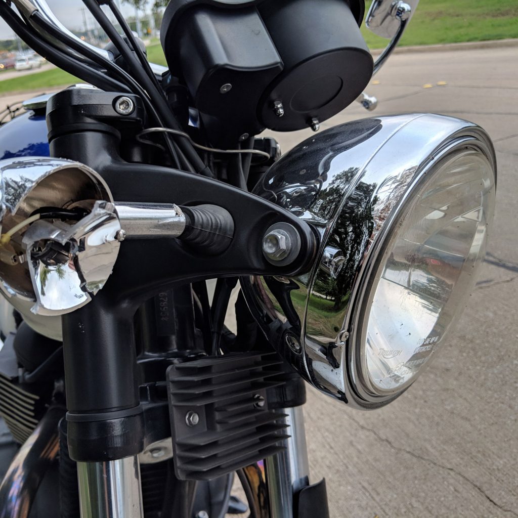 Damaged right turn signal on Triumph Bonneville.