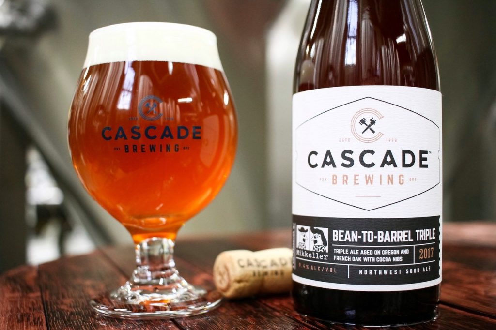 Photo of Bean to Barrel in a glass next to the bottle..