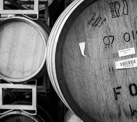 Cropped photo of barrels in the brewery side of Cooperage Brewing.
