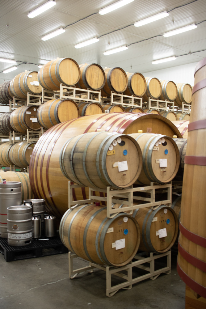Barrels stacked inside the Cascade blending facility.