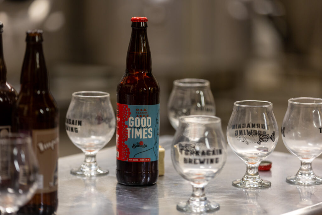 Good Times beer, brewed for La Bodega, surrounded by empty beer glasses.