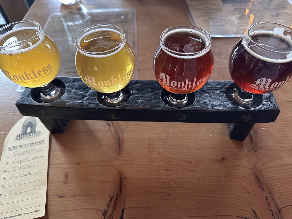 Tasting flight of four beers at Monkless brewery in Bend, Oregon.